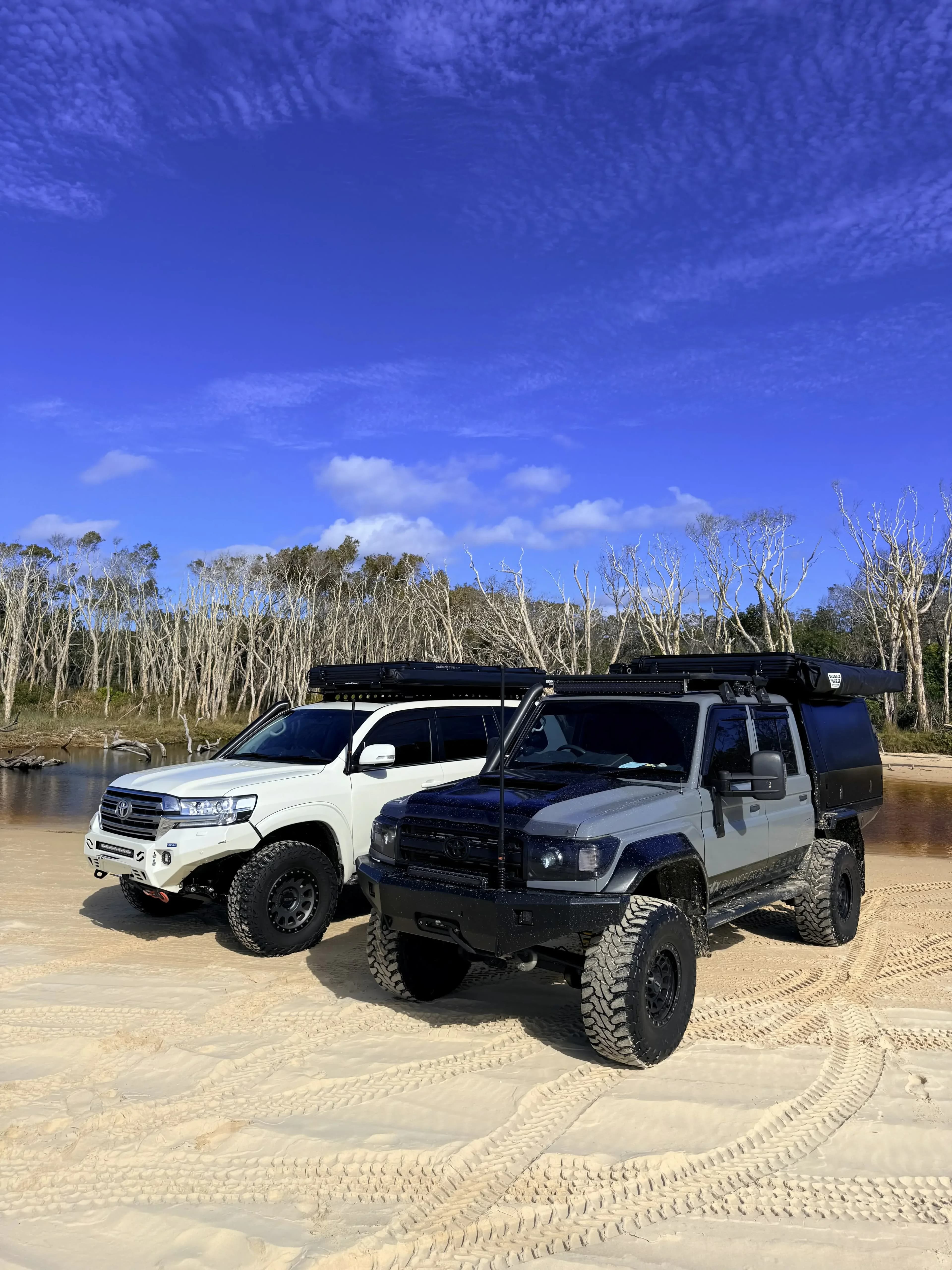 Two 4x4s on the sand at Straddie..